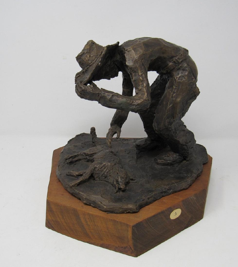 Bronze Cowboy and Dog Statue by Christopher Raymond: Approx 9 1/2" x 11" x 10" tall.