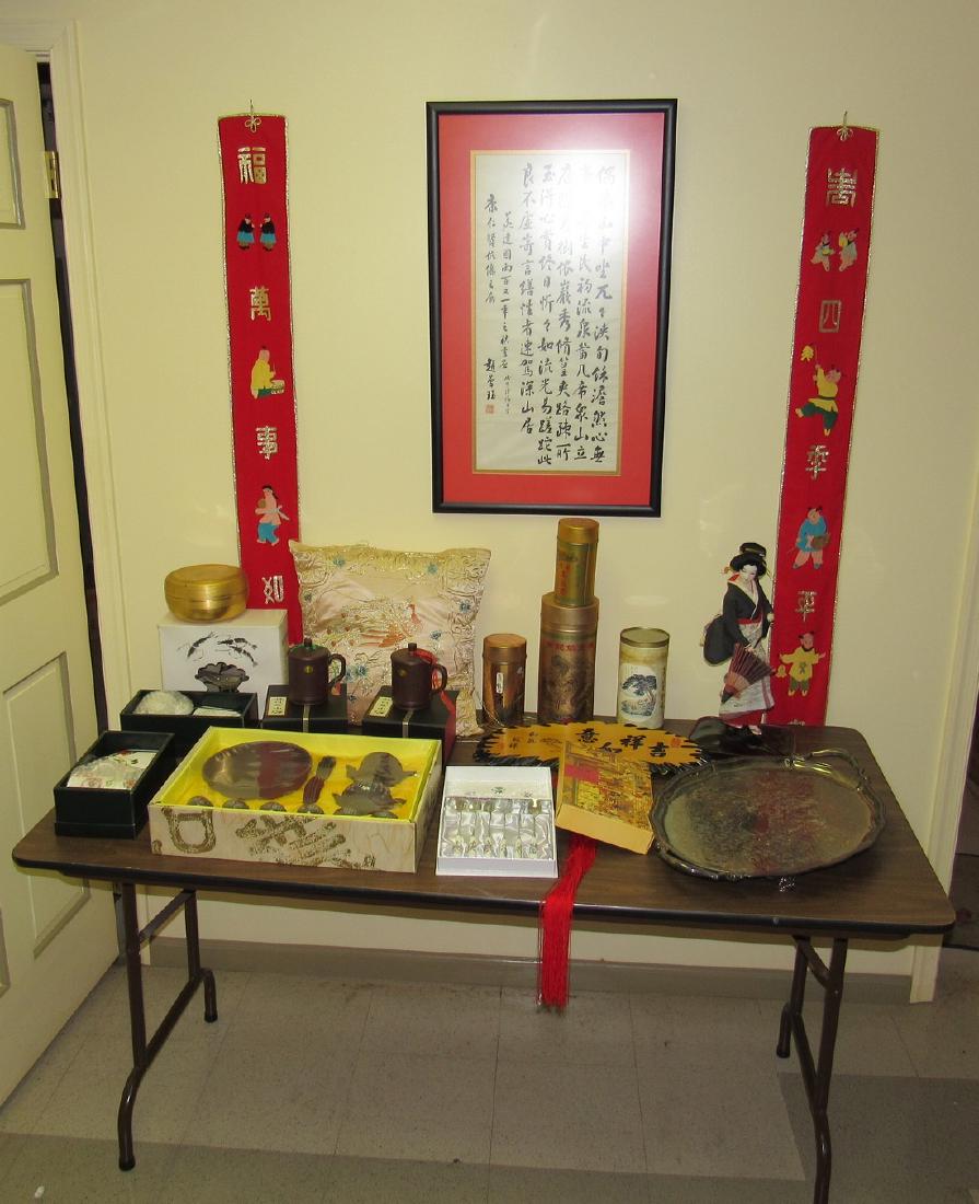 Oriental Lot and Folding Table: Getting table, contents, and items hanging on wall behind