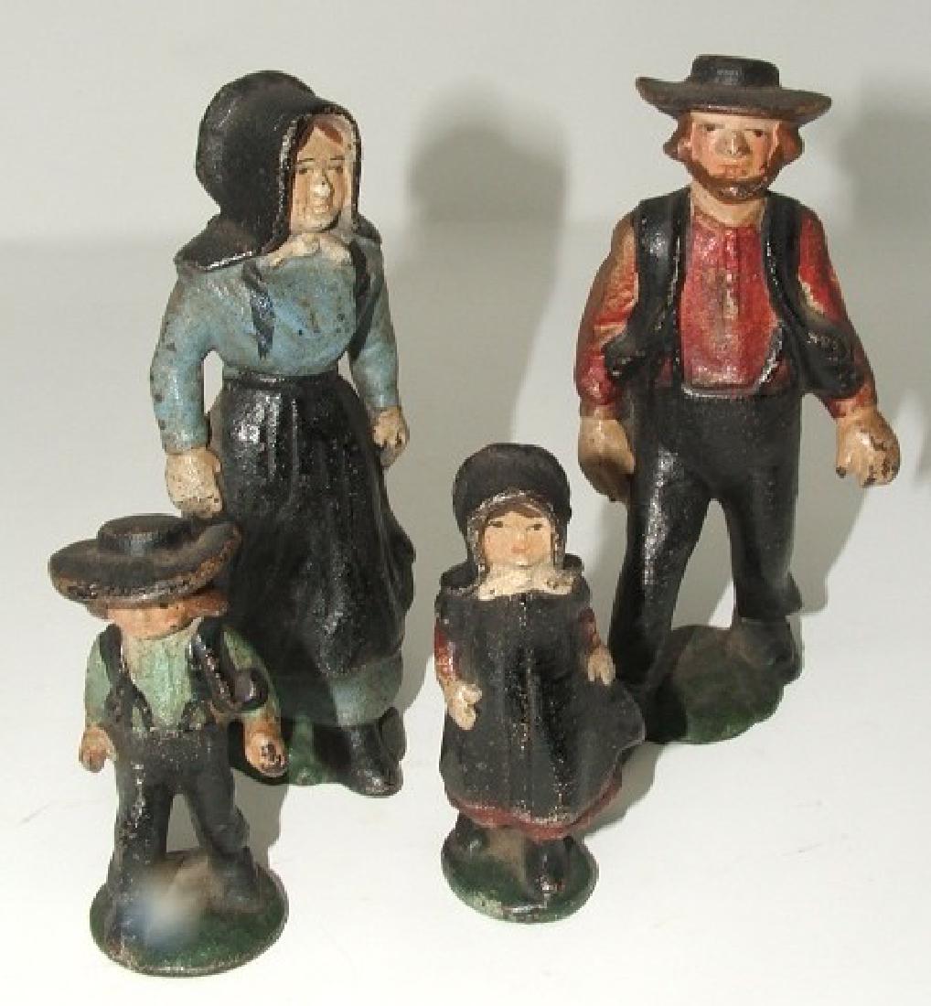 4 Cast iron Amish Figures: Large are 4 3/4", children 3"