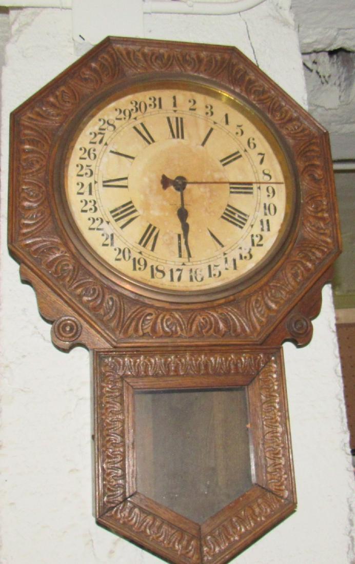 New Haven Oak School House Calendar Wall Clock: Approx 28" long. No pendulum and sold in untested condition.