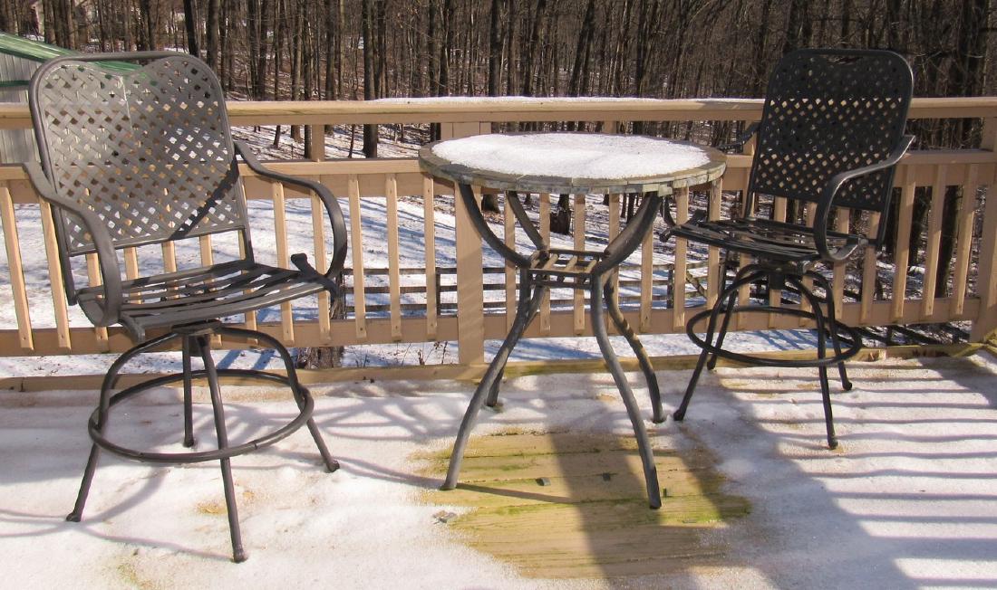 Patio Table and 4 Chairs 2 Swivel: Table Top has damage and is approx 36" tall and 33" in diameter.