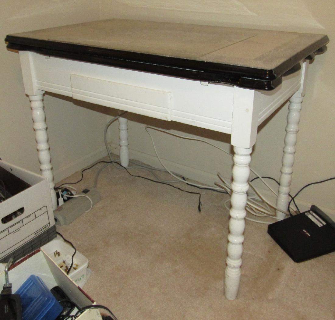 Porcelain Top Table: Approx 25" x 40" x 31" tall. Has a wear spot on top.