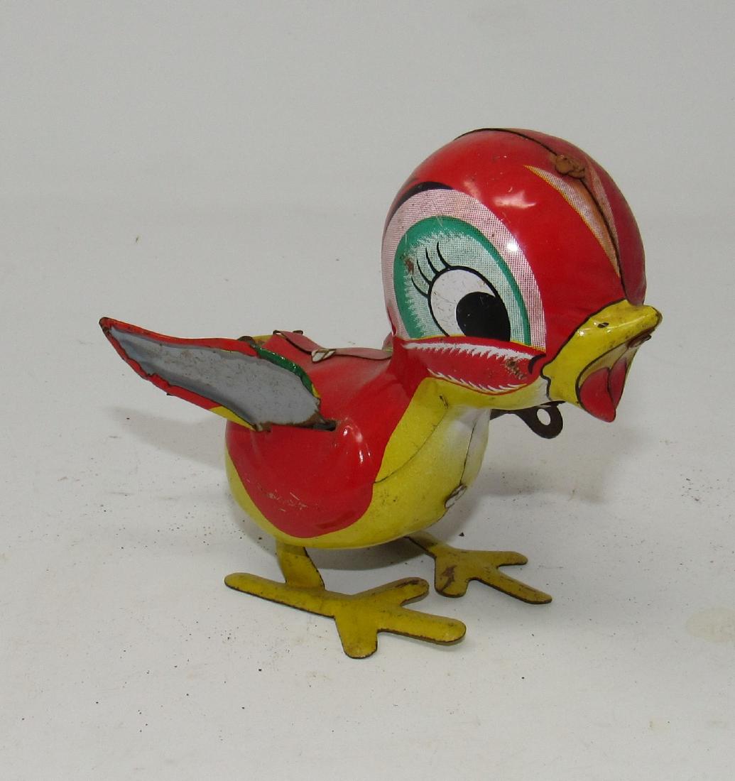 Mikuni Japan Wind Up Baby Bird Toy: Works once in a while. Approx 4" tall.