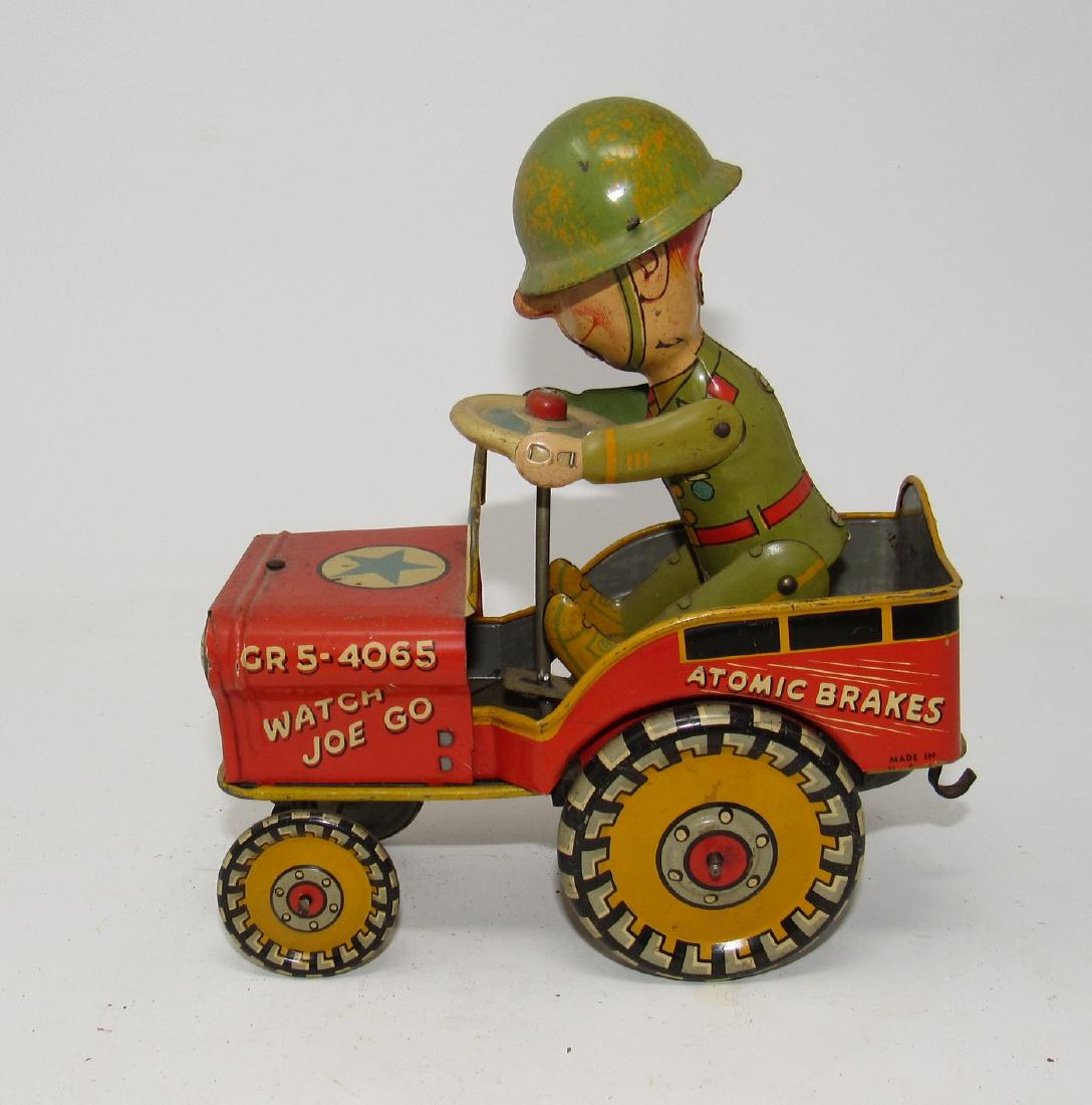GI Joe and His Jouncing Jeep Unique Art Wind Up Toy: Approx 6 1/2" long. It does work. No dents or dings