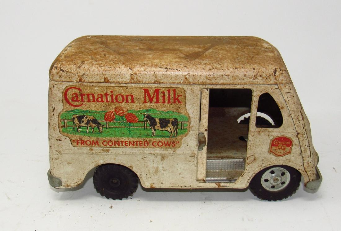 Tonka Carnation Milk Van Truck: Apprx. 12" long. Has light rust on roof and one tire is wrong
