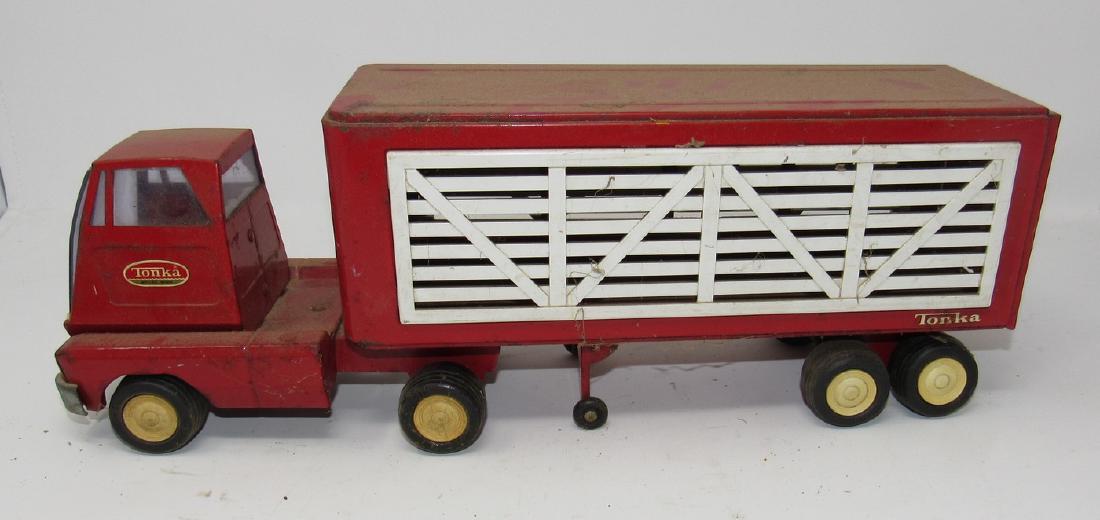 Tonka Livvestock Truck: Approx 16" long. Missing one light on passenger side. Needs light cleaning. No dents or dings.