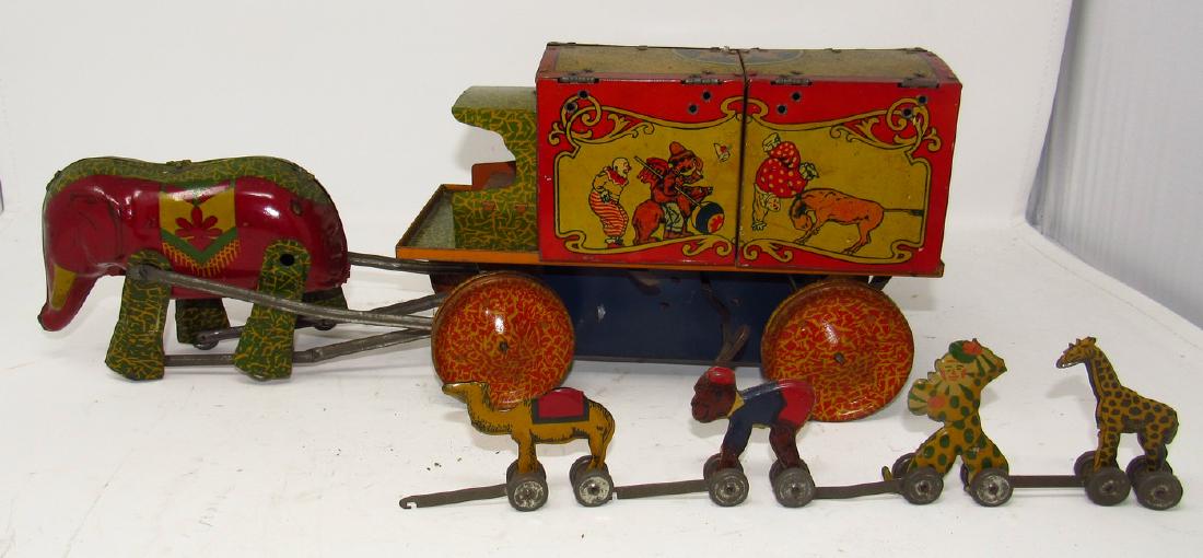Lindstrom Tin Litho Circus Wagon Wind Up Toy: Approx 18" long. Missing driver. Has a couple scratches on back doors. Over all in very nice condition. Wind Up does not work