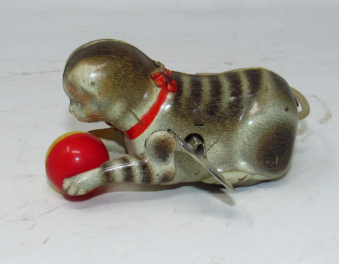 Wind Up Cat Playing Ball Toy: Approx 3 3/4" long. Does not work properly.