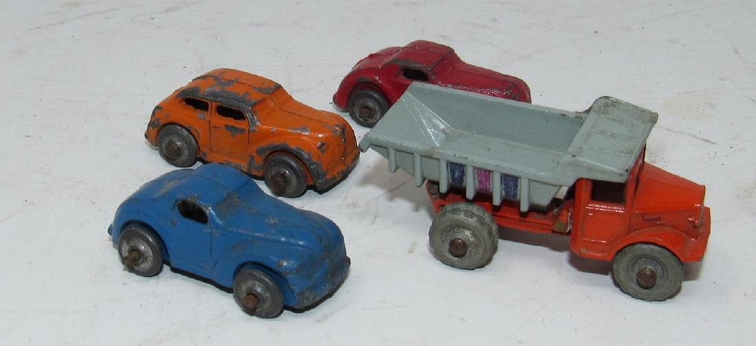 Lesney England Dump Truck and 3 Cars: Dump Truck is marked Lesney and is approx 1 3/4" long. Body is not attached. 3 Cars are not marked.