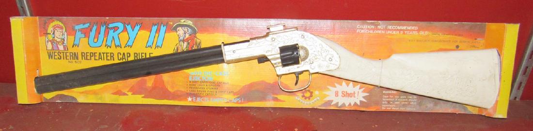 Fury II Western Repeater Cap Gun Rifle No. 602: Packaging was damp at one time. Approx 26" long.