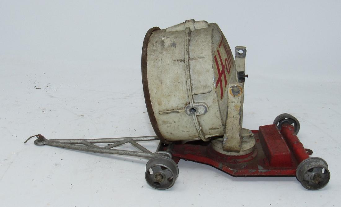 Hollywood Film Ad Trailer Toy: Approx 13 1/2" long. Needs screws put in to hold circular piece and tires. Needs to be cleaned