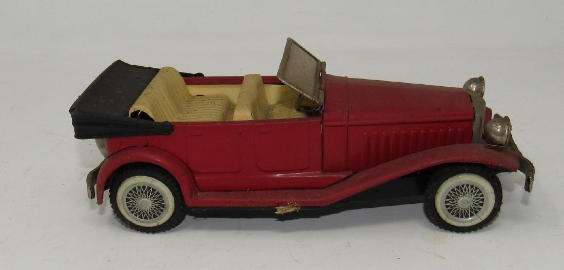 Tin Friction Toy Car Made in Japan: Approx 7 1/2" long. It does work and needs to be cleaned