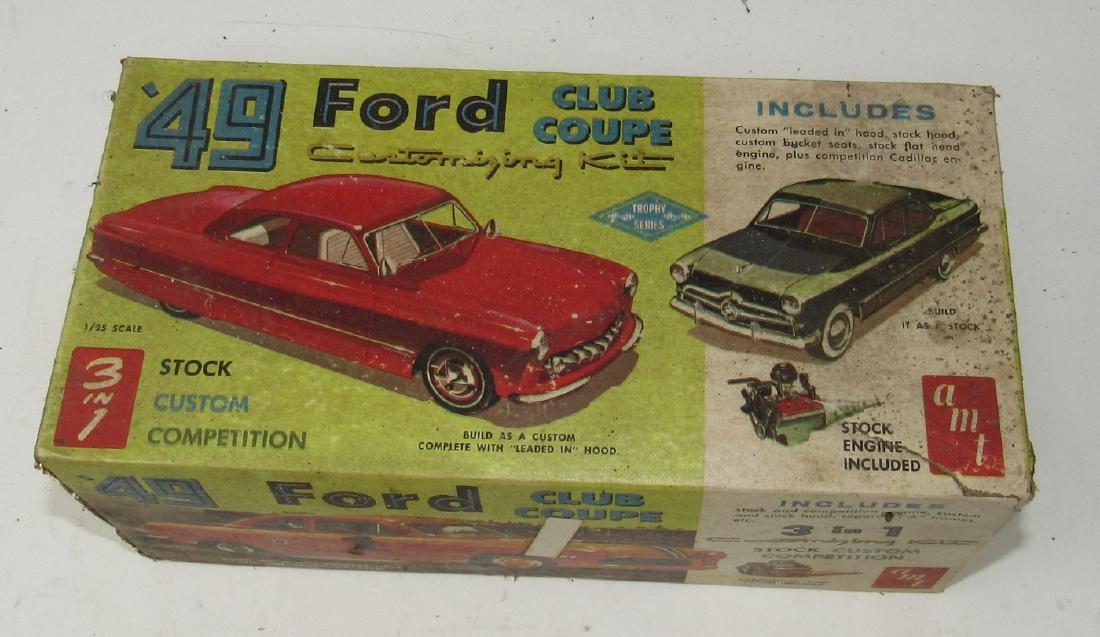1949 Ford Club Coupe 3in1 AMT Model: Box does have a tear. We do not look thru and make sure all the parts are there or if there are any broken pieces. Sold as is,