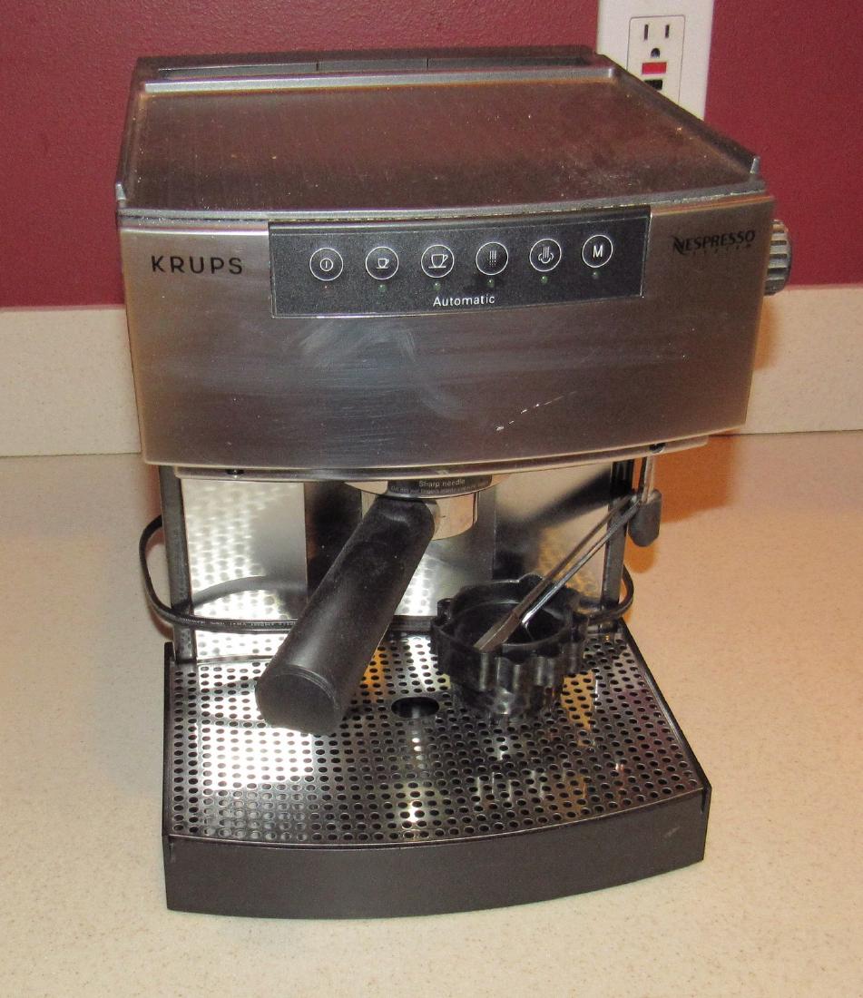 Krups Espresso Machine: Powers on. Needs light cleaning. Sold in untested condition