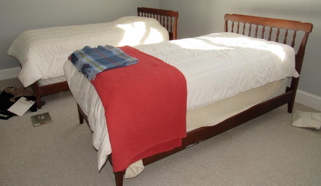 2 Twin Beds: Lot includes beds, mattresses, and comforters.