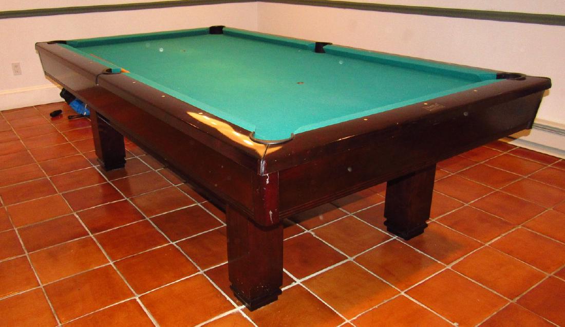 Brunswick Billards Pool Table: Approx 55" x 99". Buyer must remove from basement