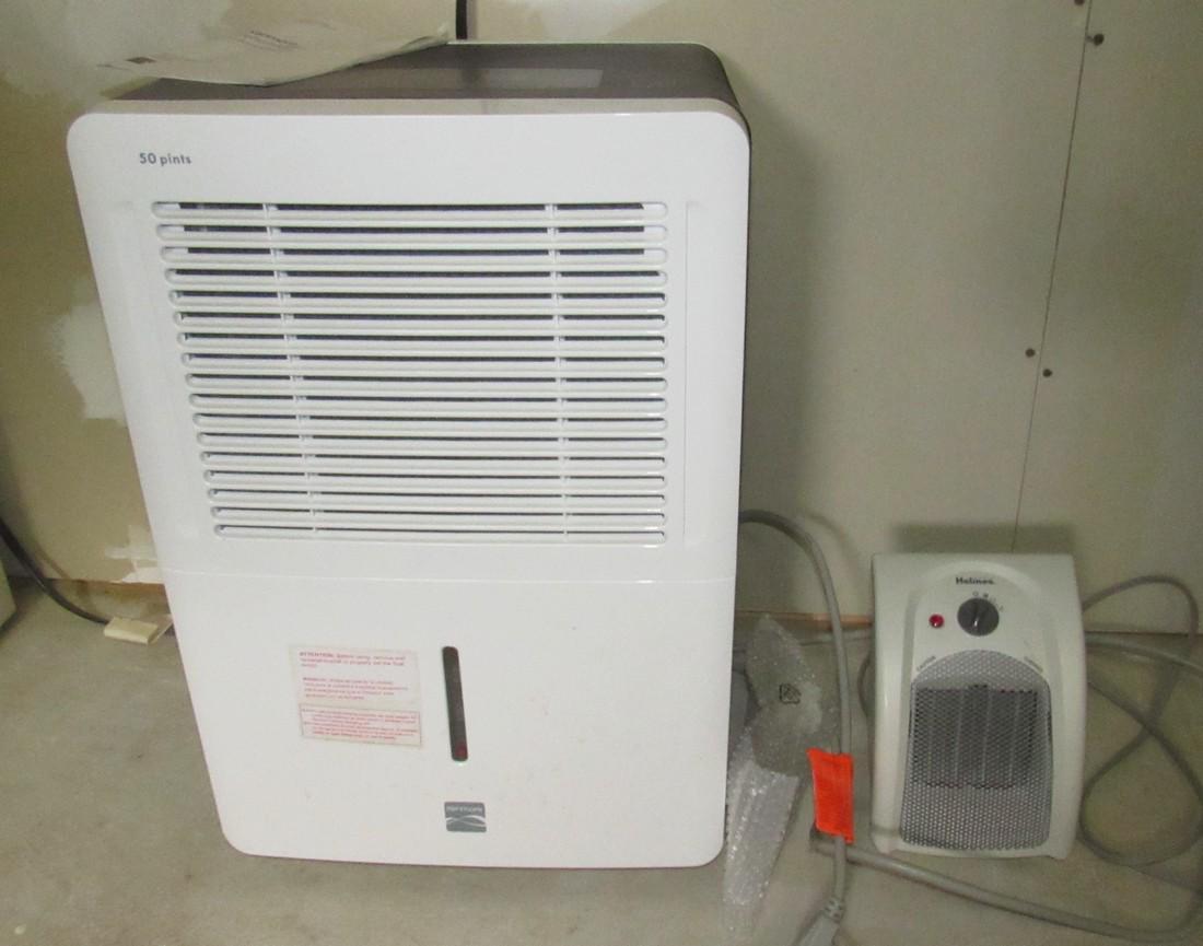 Kenmore 50 Pint Dehumidifier and Holmes Heater: Plugged both in and they powered on. Sold in untested condition