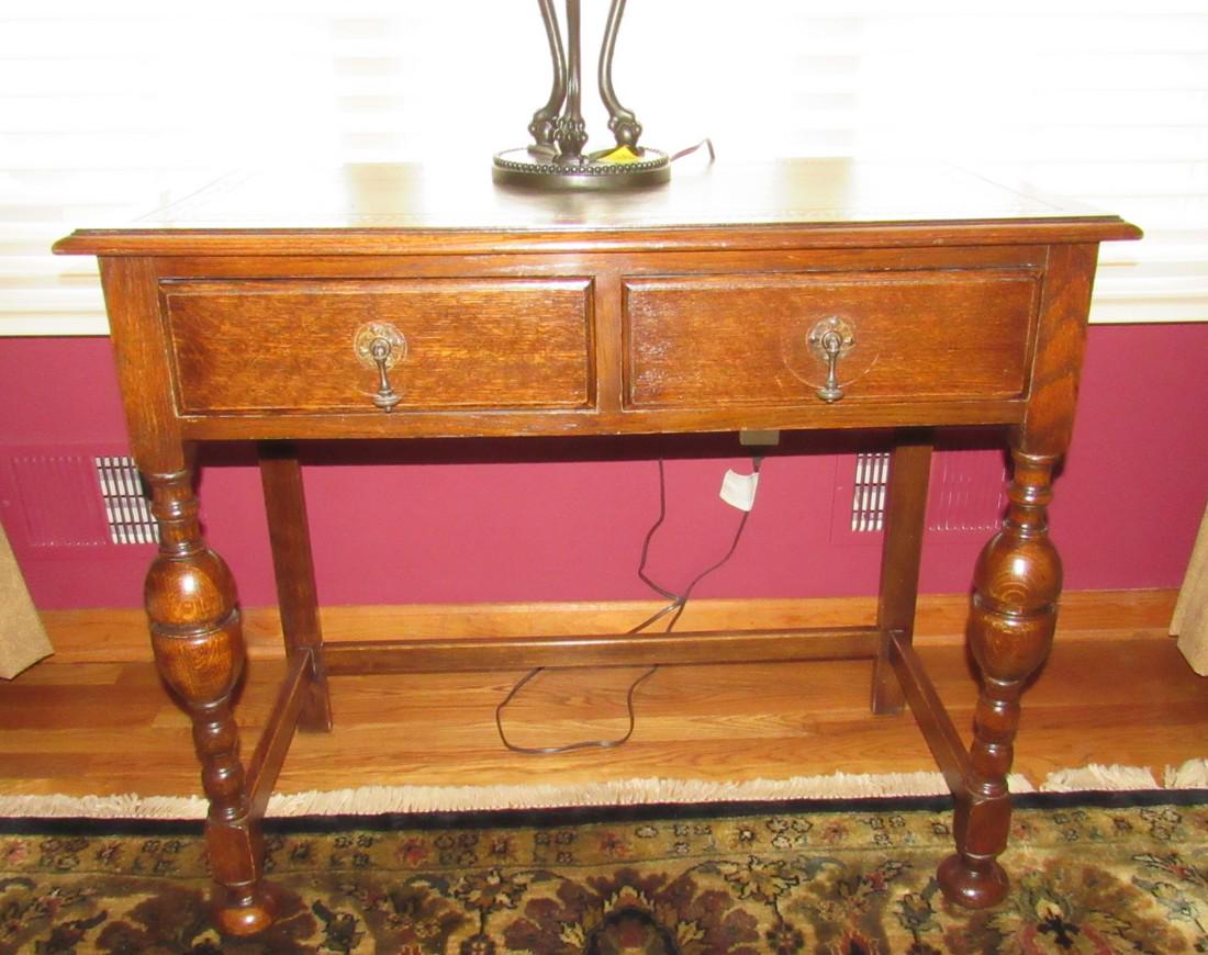2 Drawer Oak Leather Top Side Table: Approx 19" x 36" x 30 1/2" tall. Does not include items on it