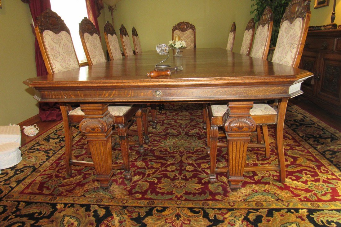 Massive Oak Dining Room Table: Approx 54" x 12'2" x 30" tall. Has 4 leaves currently in it, measuring 19" each. Very nice condition. Chairs are sold separately.