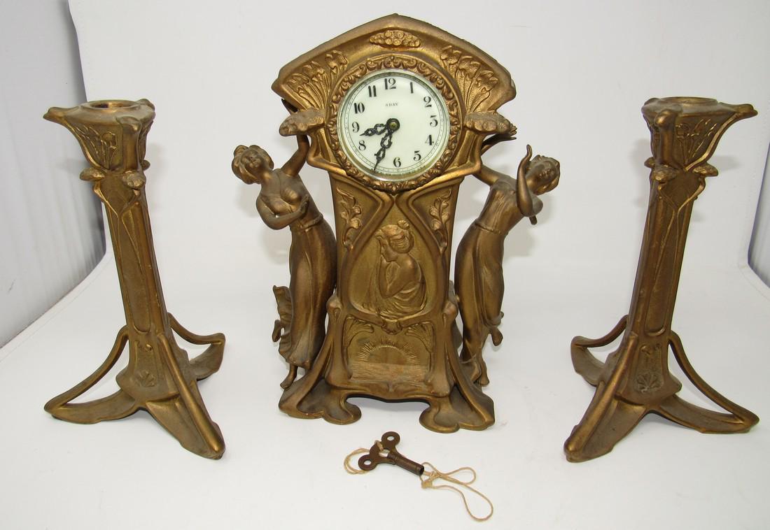 New Haven 8 day Art Nouveau Figural Clock and: Clock is approx 11" tall. Gilt Metal, key included.