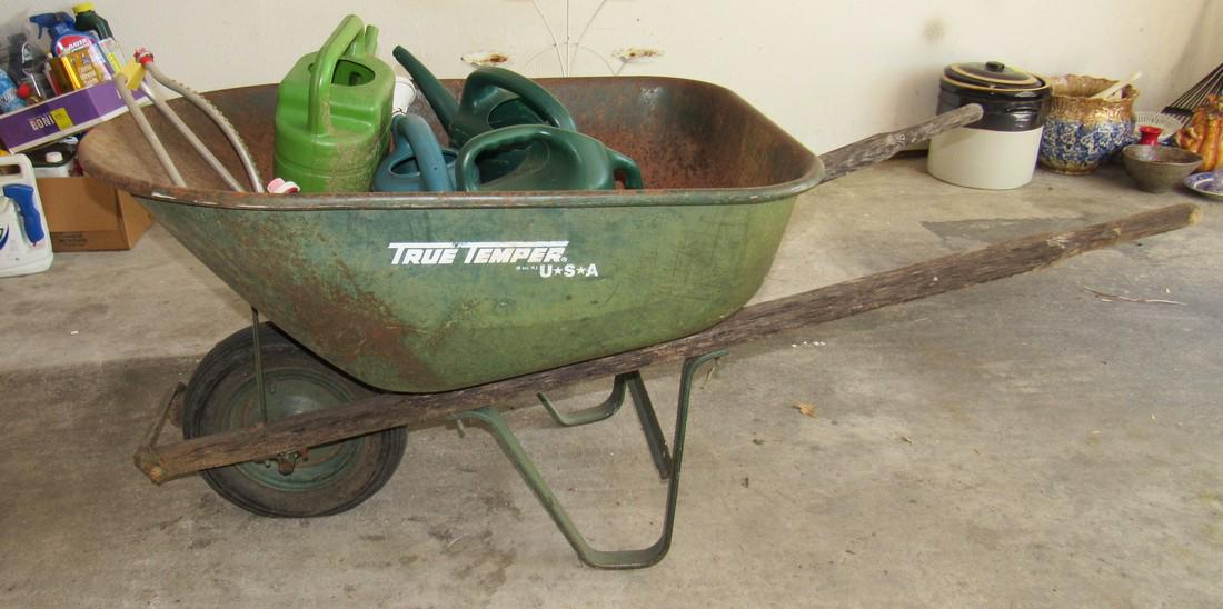 True Temper Wheel Barrow and Water Cans: Wheel barrow tire is flat