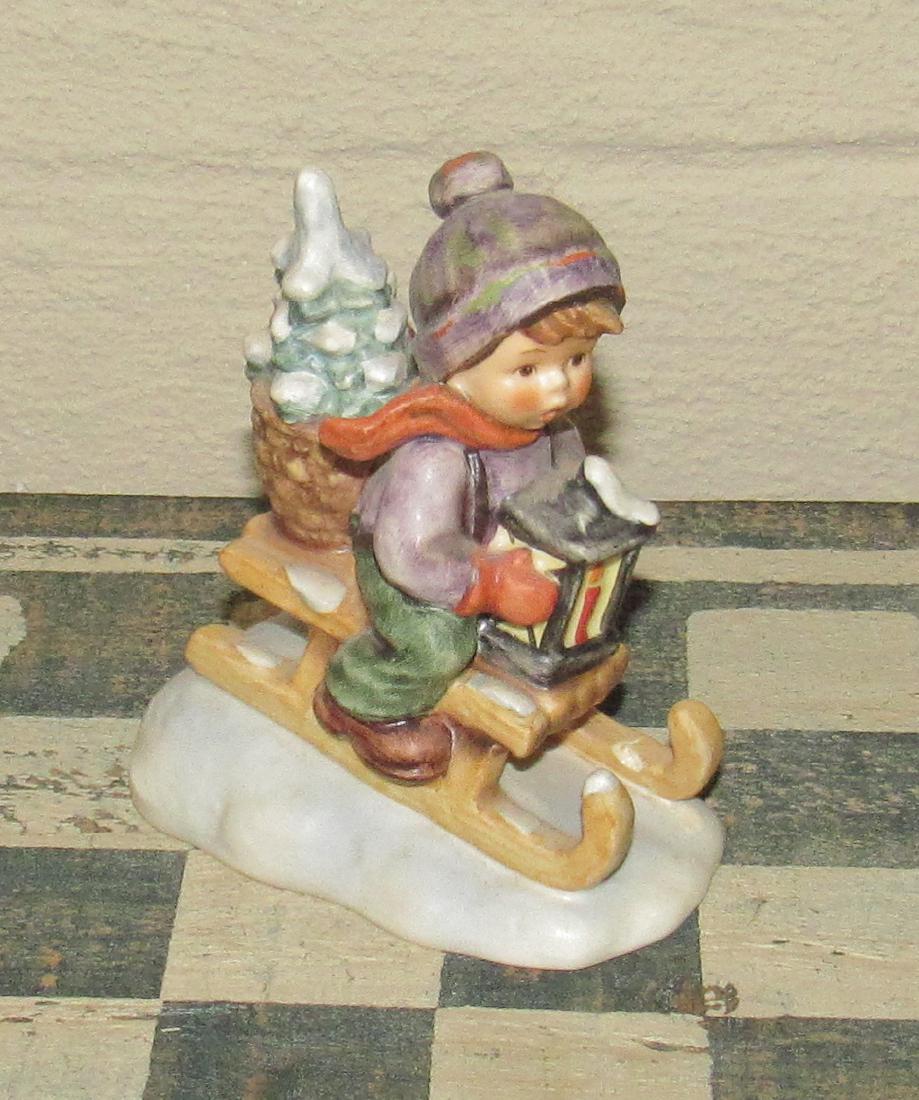 1981 Goebel Hummel 396 Boy on Sled with Christmas Tree: Approx 4 1/2" tall.