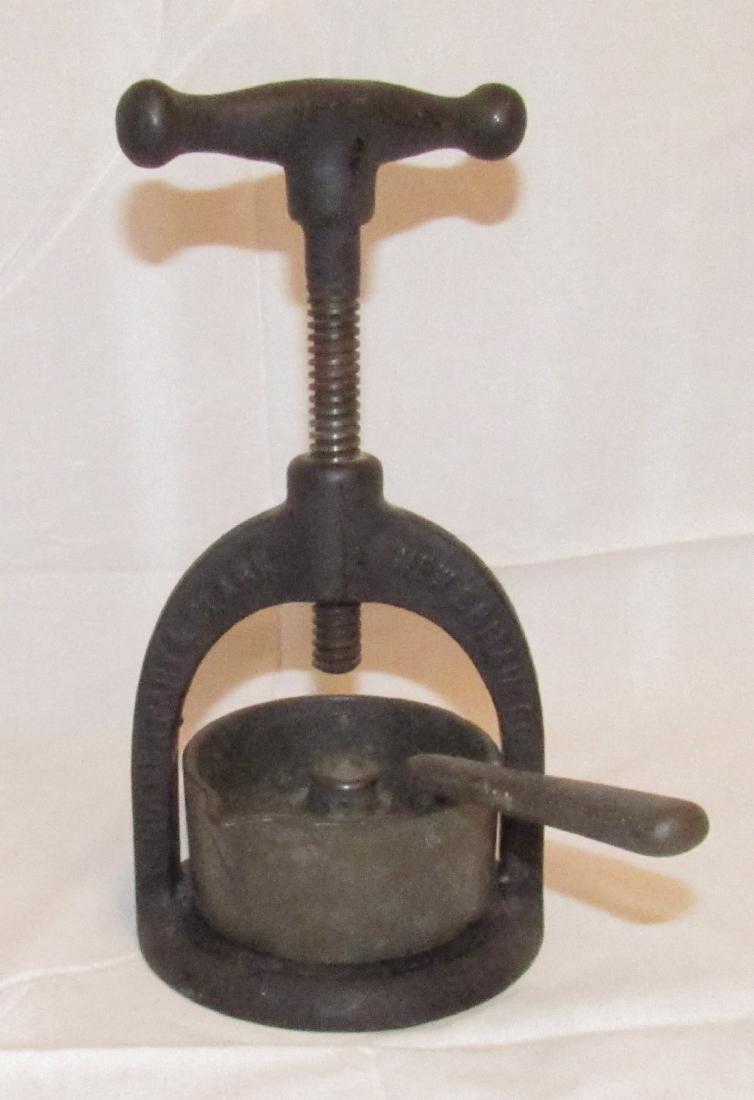 Landers Frary and Clark Columbia Meat Juice Press: Approx 4 1/2" in diameter and 9 1/4" tall