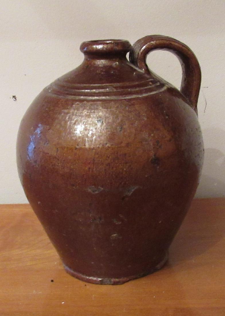 Redware Jug: Approx 6 1/2" in diameter and 9 1/2" tall