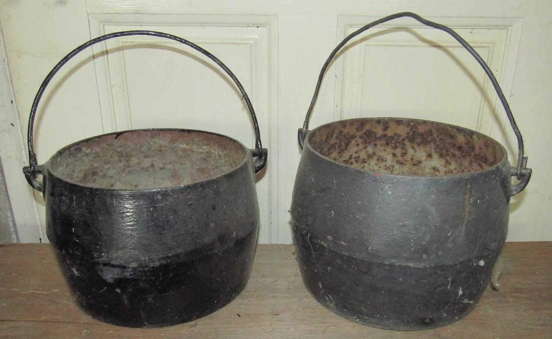 2 Cast Iron Kettles: One on right is approx 9 1/2" in diameter and 7 1/2" tall.