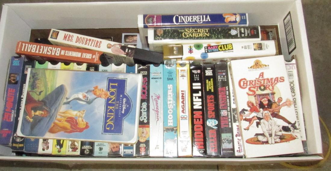 Box Full of VHS Tapes: Getting all in box.