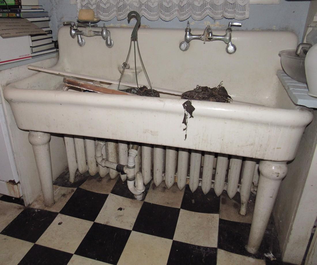 Antique Cast Iron 2 Bay Farmhouse Sink: Approx 27" x 55" x 40" tall. Buyer's responsibility to safely remove.
