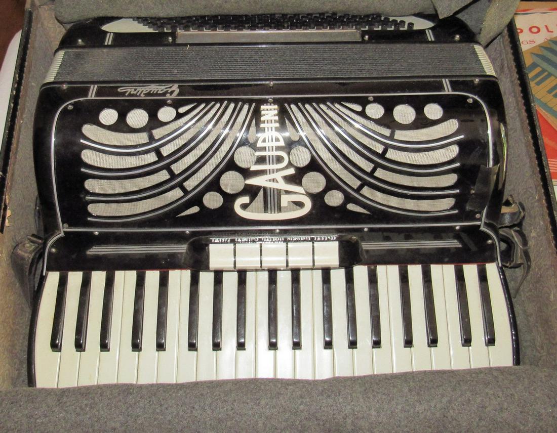 Gaudini Accordian: Approx 19" wide. Comes with Sheet music