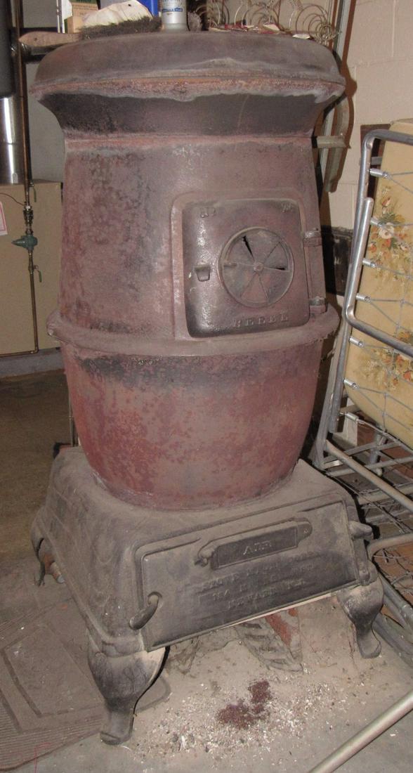 Large Potbelly Stove: Approx 54" tall and 26" in diameter. Must be removed from basement