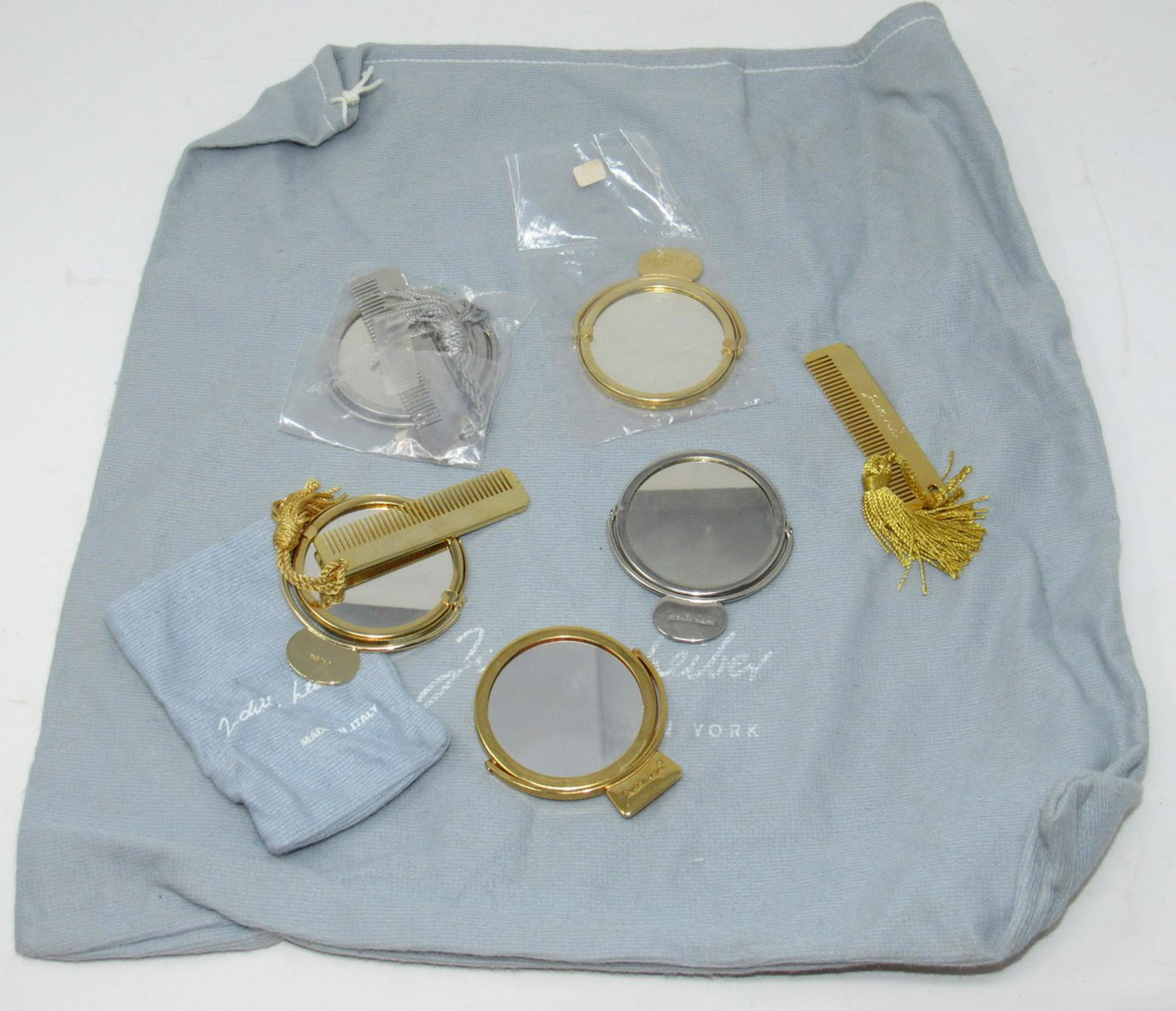 Judith Leiber Handbag Mirrors Combs and Bag: Lot includes ( 5) mirrors 2 3/8" in diameter and ( 3 ) combs 3" long, with the 2 bags pictured