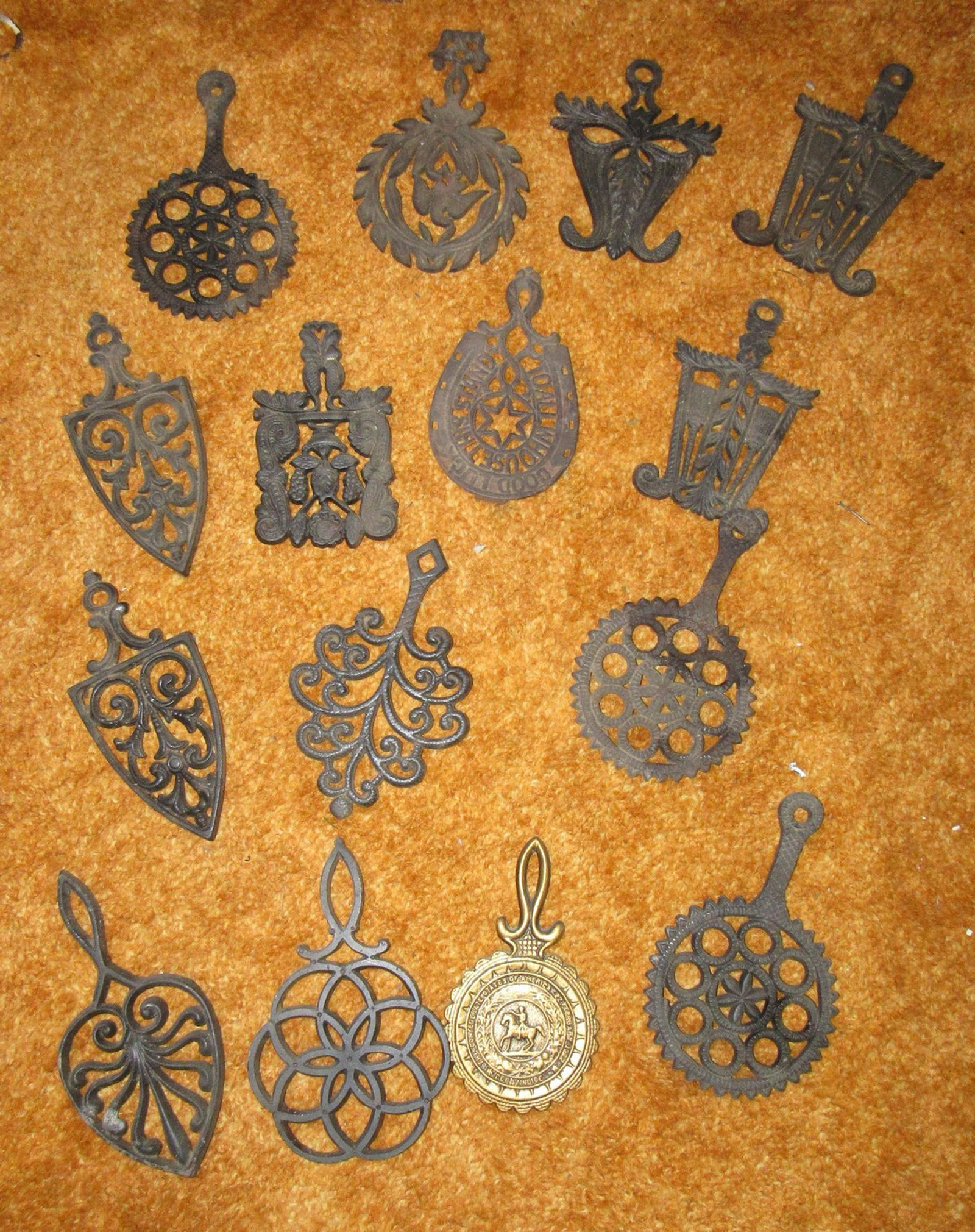 Cast Iron and Aluminum Trivets: Getting all pictured. 4 in front row are aluminum