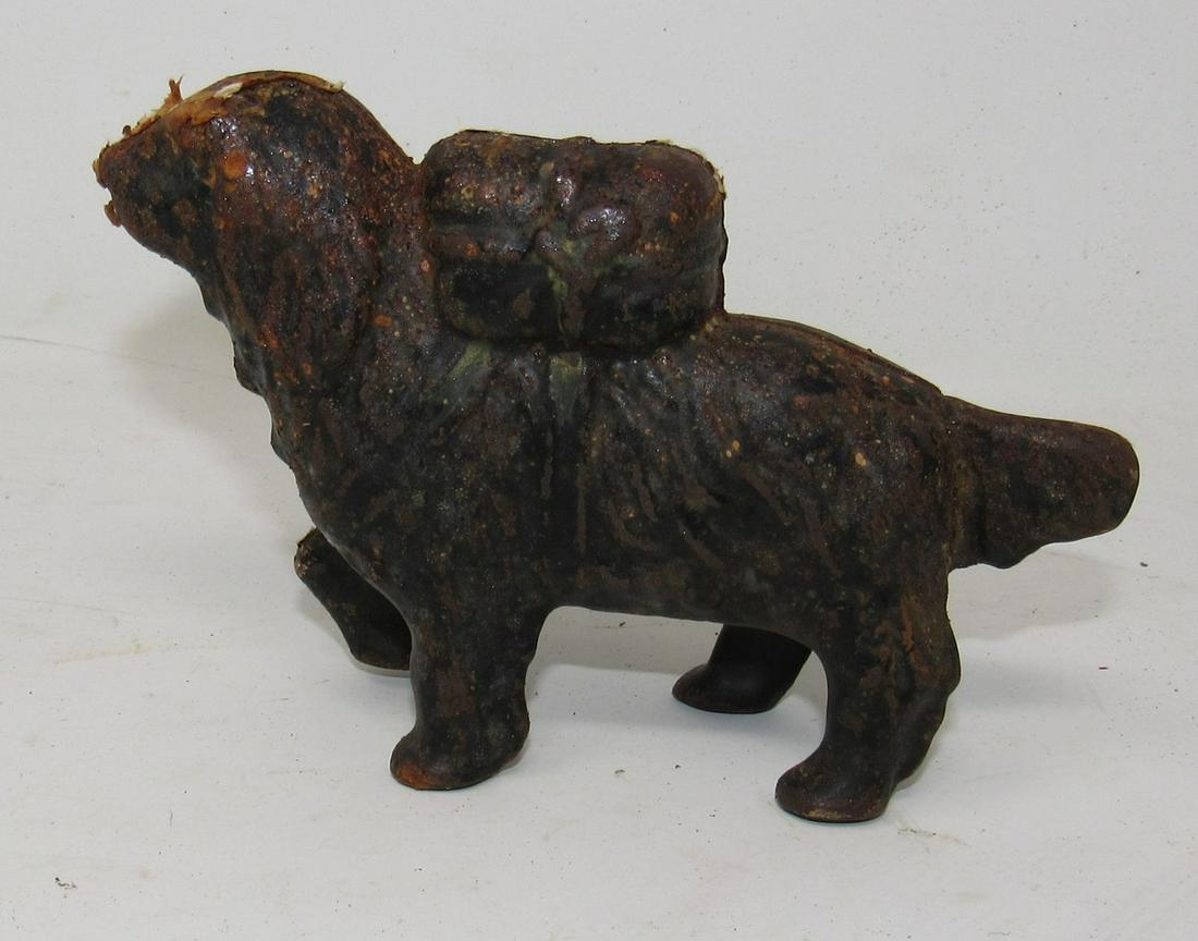 Cast Iron Dog Bank: Approx 5 1/2" long and 3 1/2" tall.
