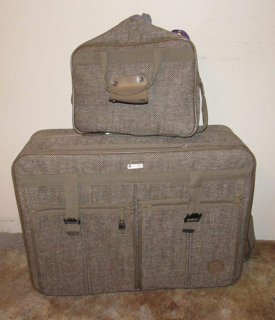 American Flyer Suitcase and Carry on Bag: Has some clothes in them.