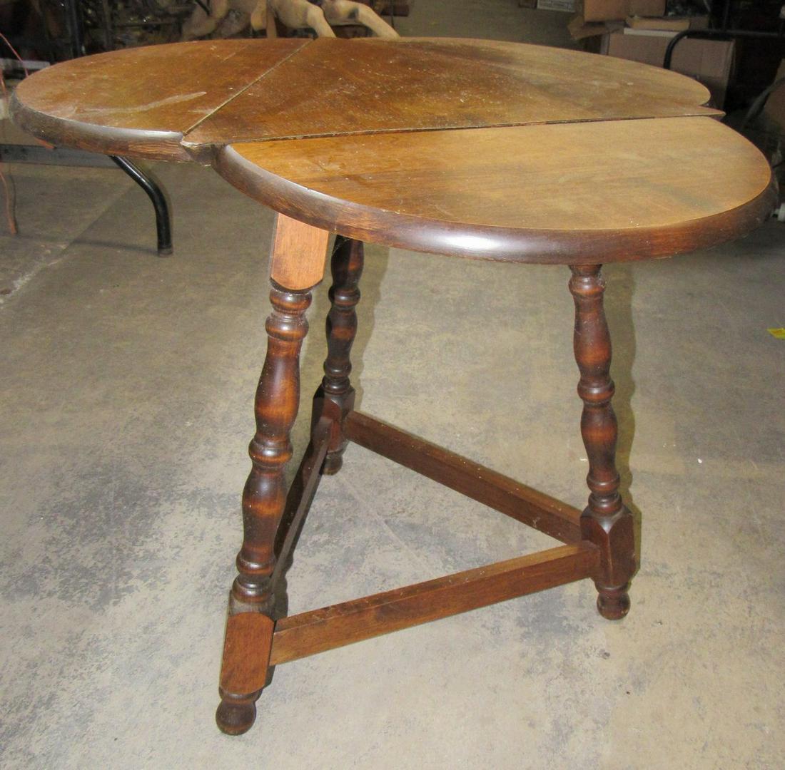 Drop Leaf End Table: Approx 23" tall and 27" in diameter.