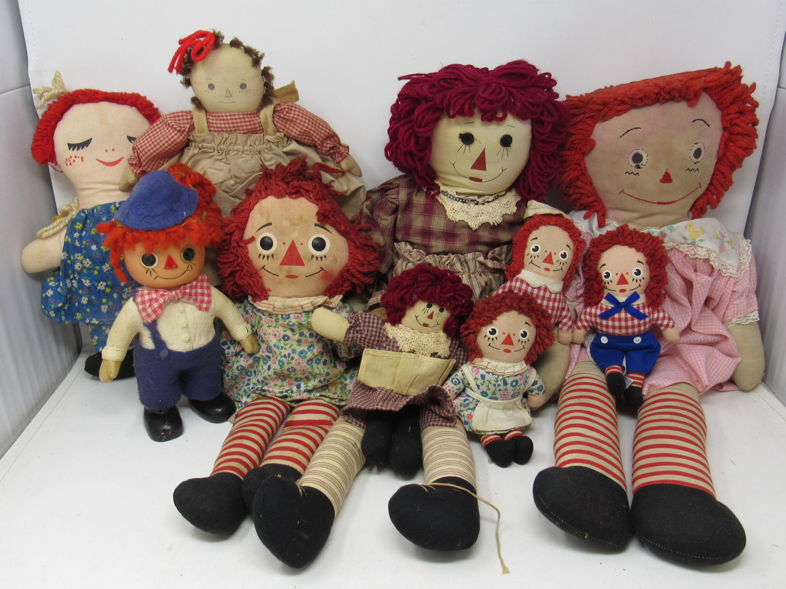 Raggedy Ann & Andy Rag Dolls: One is 1974 Hard plastic. Largest is approx 24"