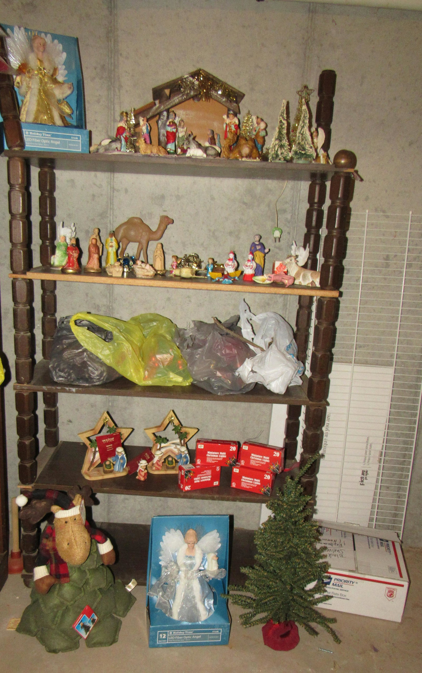Shelf Contents with Christmas and Nativity Scene: Lot includes shelf and everything on it , and 3 items on floor in front of it.