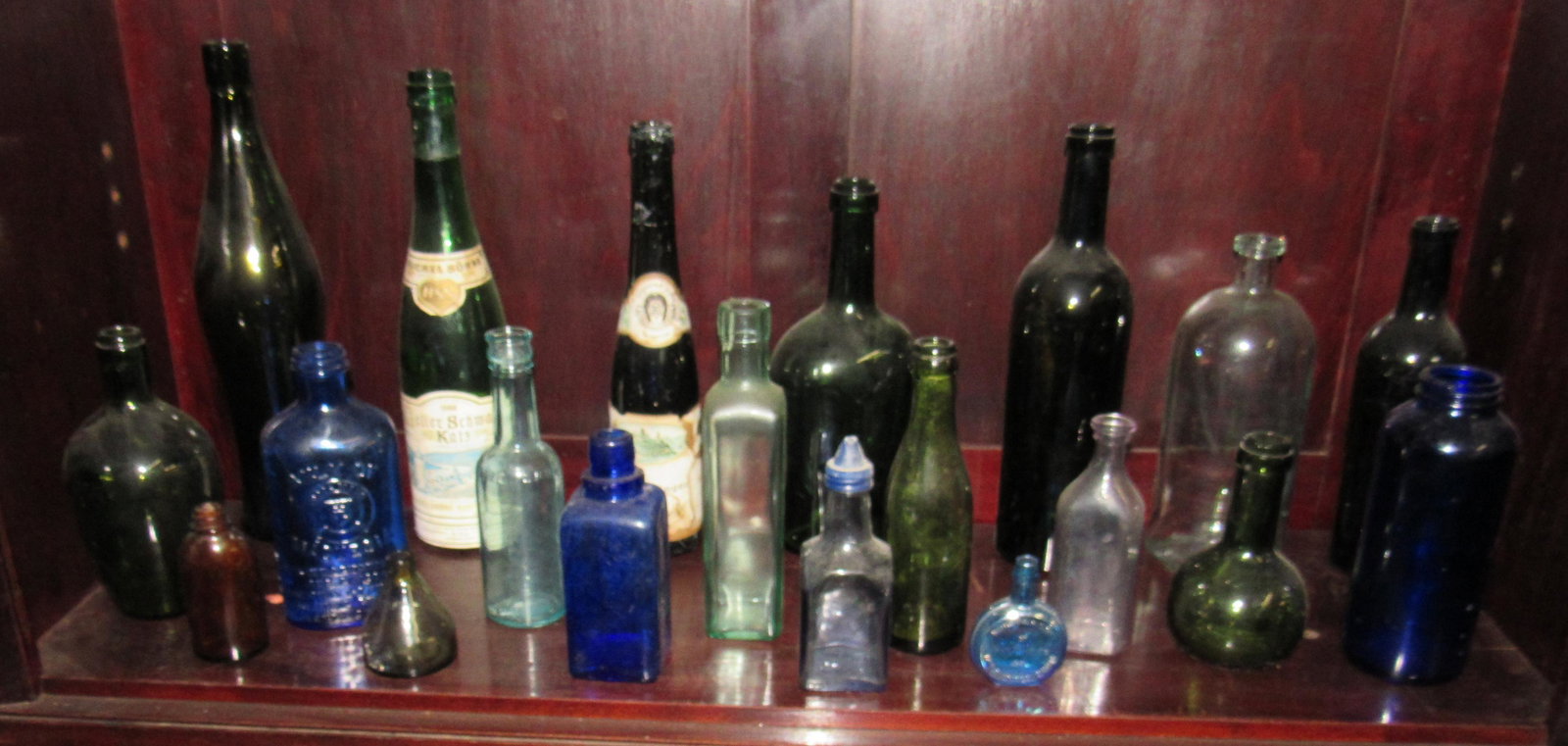 Shelf Contents of Bottles: Tallest is apprx 13 1/2" tall
