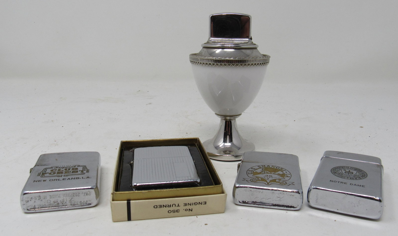 Zippo Corinthian USS Shagri La Lighters: All are Zippo , except front row on right.