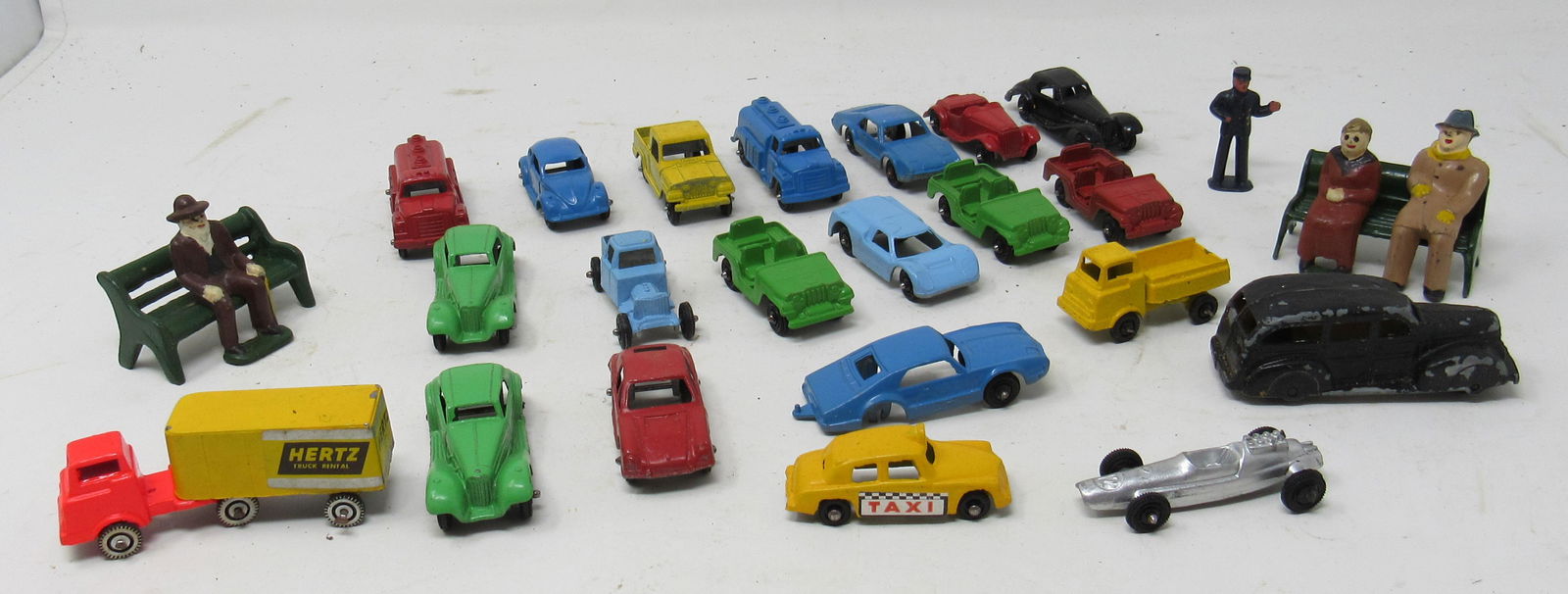 Tootsie Toys Lead Policeman Cast Iron People on Benches: Largest toy is approx 2 7/8" long