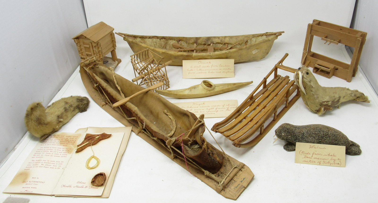 Alaskan Eskimo Miniature Hide Canoe Kayak Dog Sleds: Largest Canoe is approx 17"