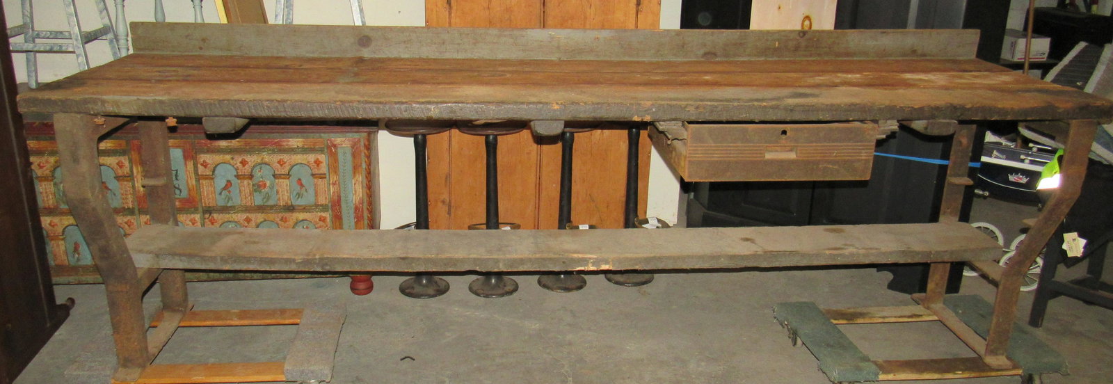 Industrial Workbench with Cast Iron Legs and Drawer: Approx 28" x 9'3" x 34 1/4" tall ( to table top). Dollies under it not included !