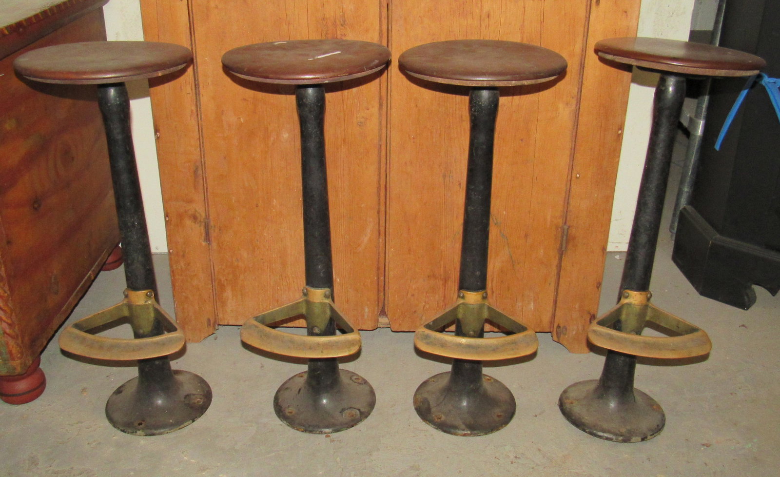 4 Cast Iron Diner CafÃ© Stools with Brass Foot Rests: Approx 27" tall and seat is approx 10 1/2" in diameter