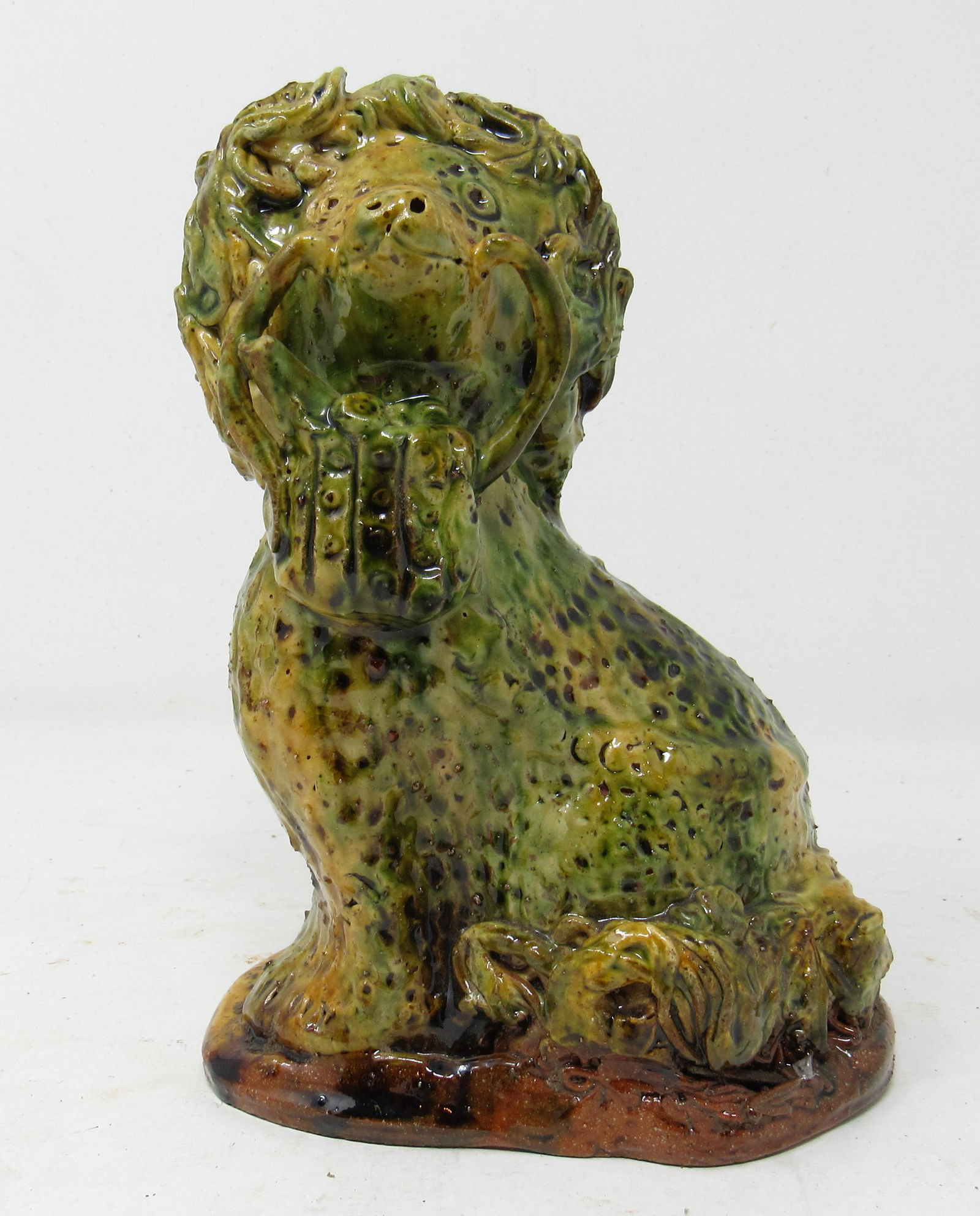 Glazed Redware Dog with Purse Att. To Robert Stauffer: Approx 7 1/2" tall. This is attributed to Robert Stauffer. It is not signed