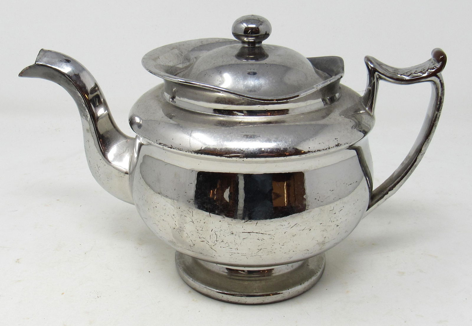 Redware Teapot with Chrome Finish: Approx 7" tall.