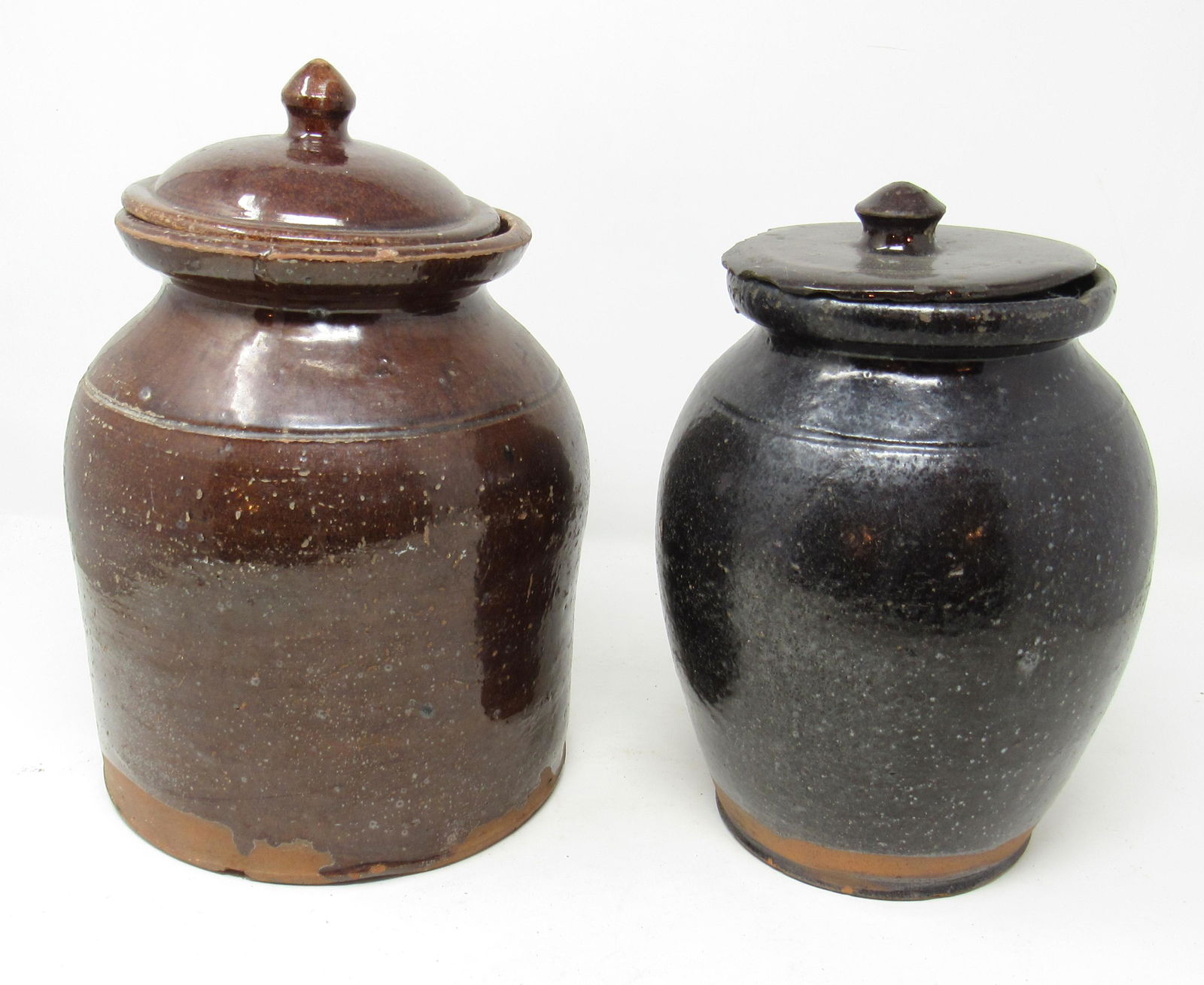 2 Redware Pottery Preserve Jars / Crocks: One on left is approx 7" in diameter and 8 3/4" tall.