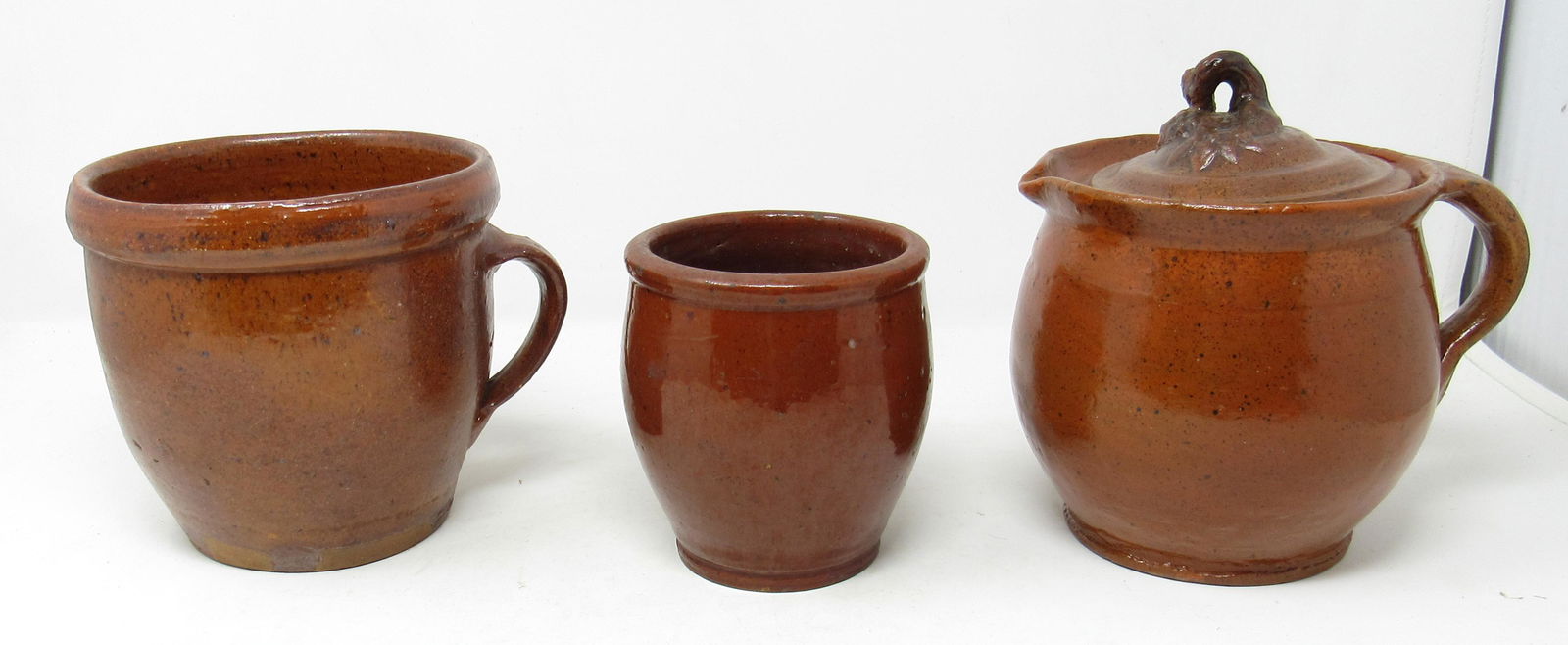 3 Pieces of Redware Pottery: Tallest is approx 7" tall.